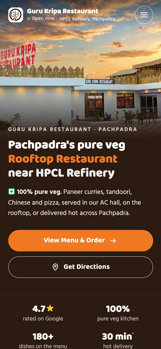Guru Kripa Restaurant Pachpadra website on a phone